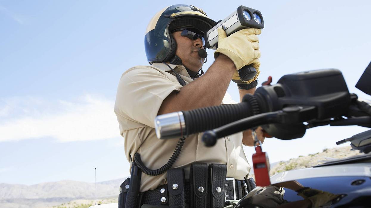 Police Officer Holding Radar Gun