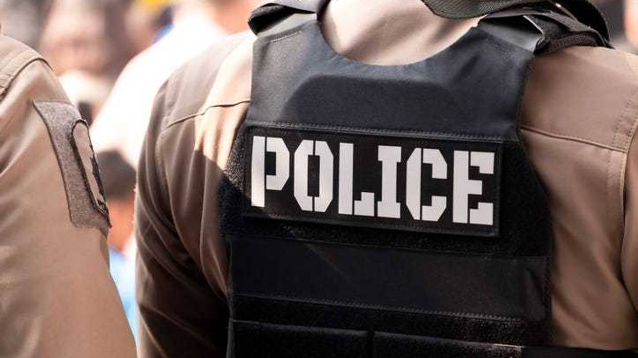 Police officer in a bullet proof vest.