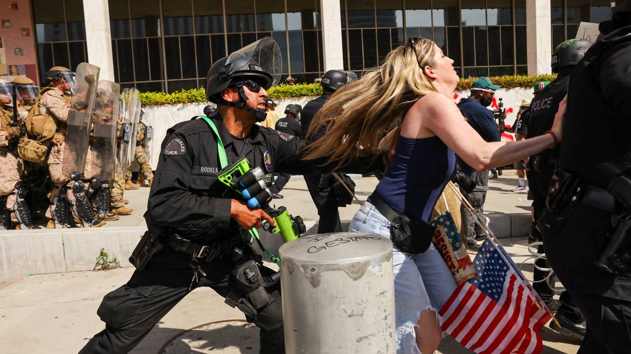 police officer pushing running woman