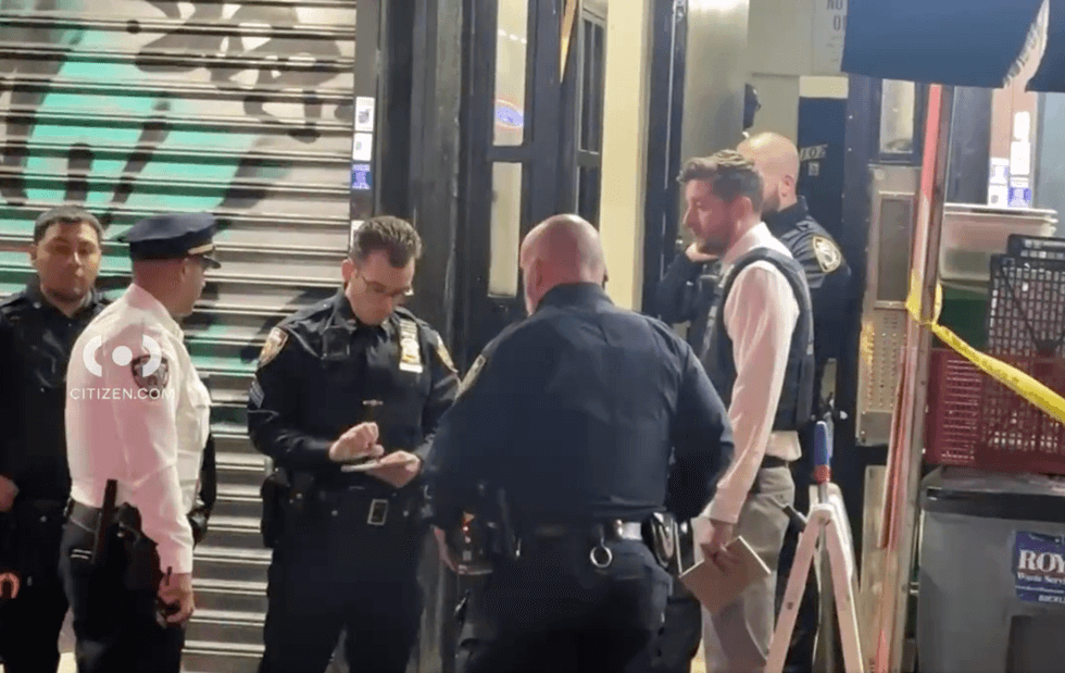 Police officers and detectives were seen outside the apartment building and in the lobby