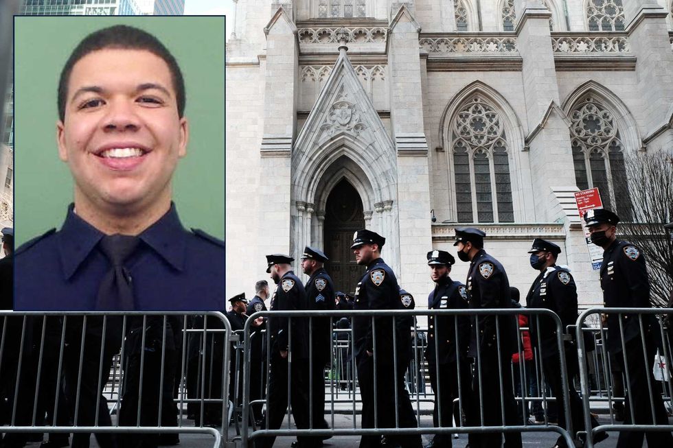 Police officers and members of the public line up to pay their respects to the fallen NYPD Officer Jason Rivera during his wake at St. Patrick