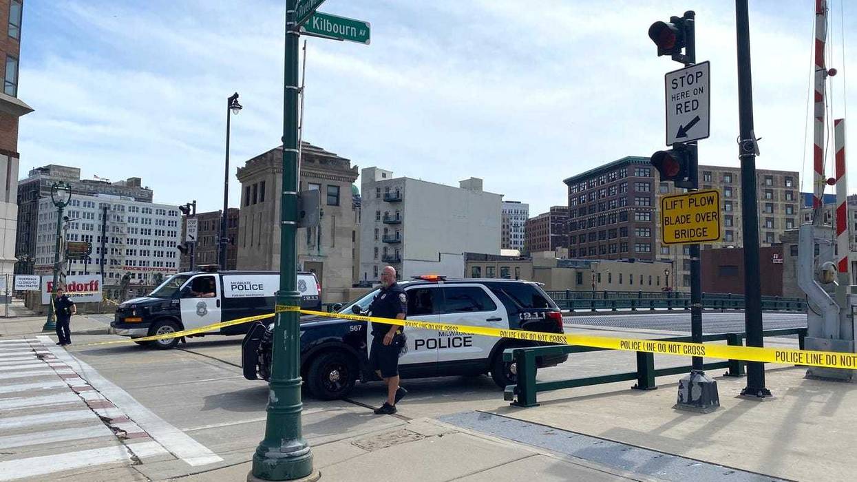 Police officers close off access to the Kilbourn Avenue Bridge after a 77-year-old man died as the bridge was being raised on Monday August 15, 2022.