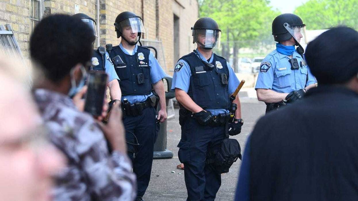 Police officers form a line in an alley next to the Minneapolis Police Department s Third Precinct headquarters at the Intersection of Hennepin Ave. and Lake Street Thursday, May 28, 2020, in Minneapolis.