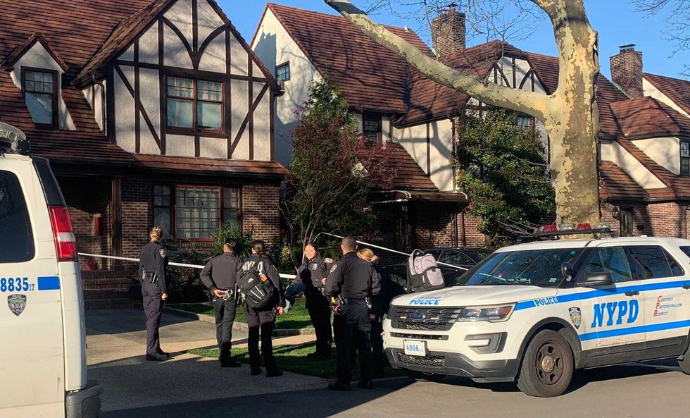 Police officers guard the home of Orsolya Gaal on Monday