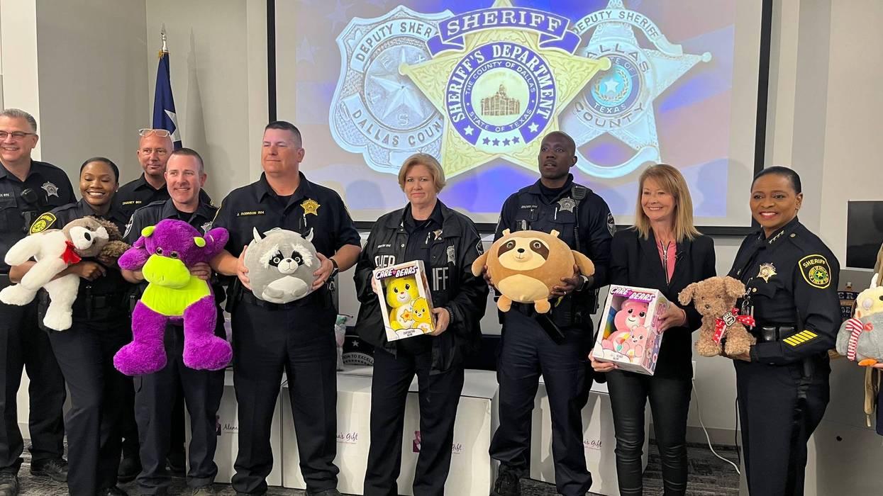 police officers holding bears