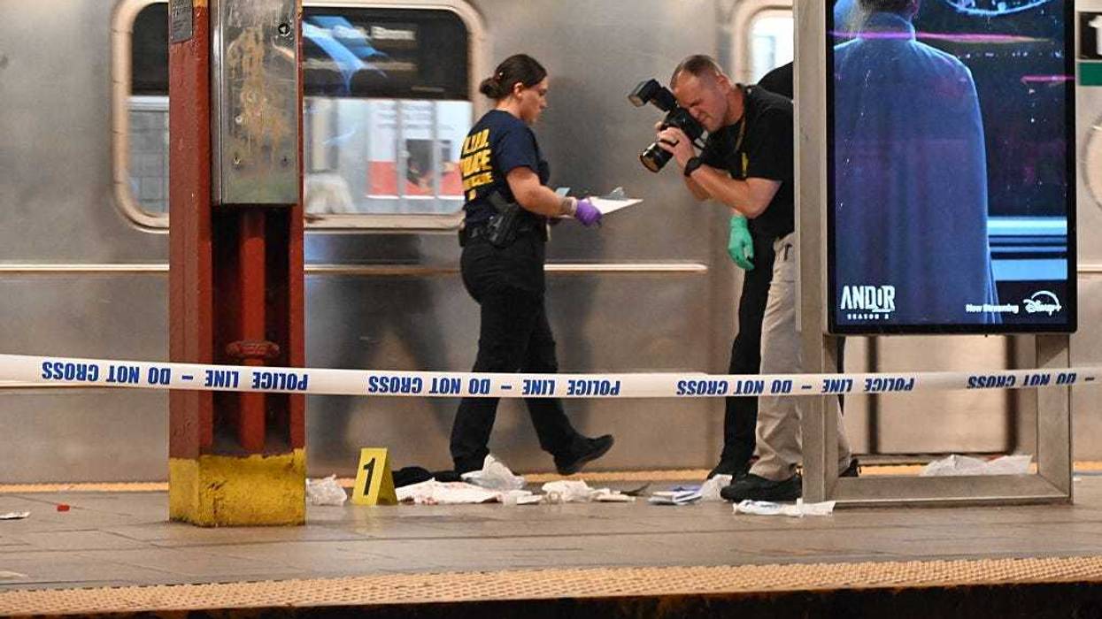 Police officers investigate the scene after a 38-year-old man was fatally stabbed at the Brooklyn Bridge-City Hall subway station in Manhattan on April 25, 2025.