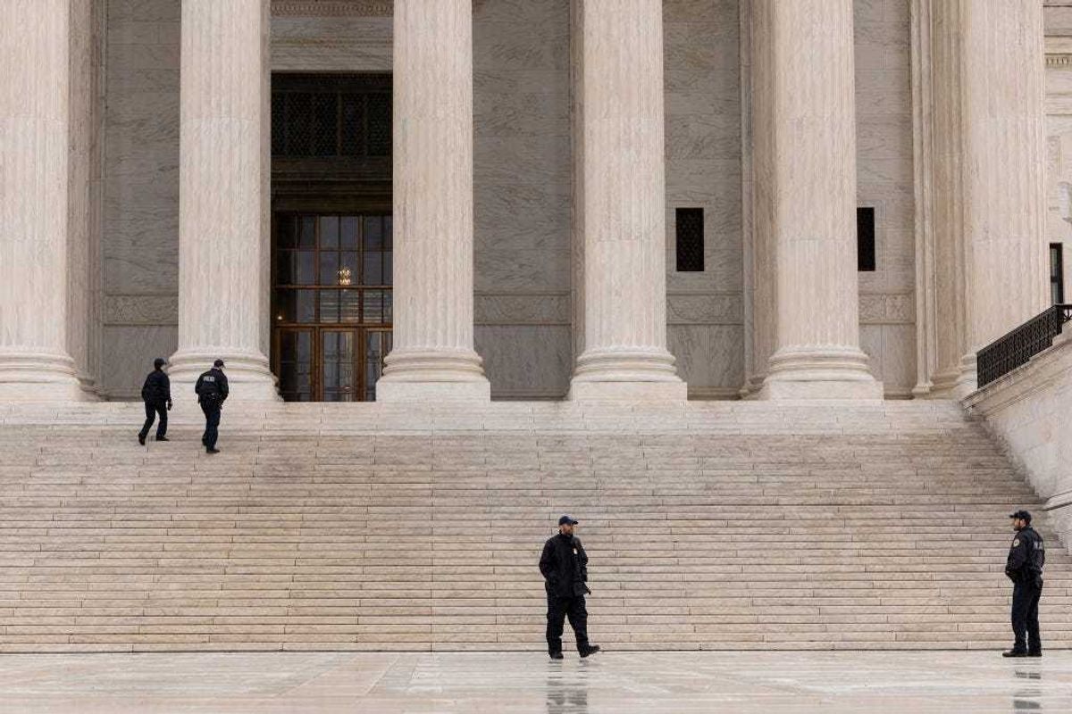 Police officers stand on the front plaza of the U.S. Supreme Court on February 22, 2023 in Washington, DC.