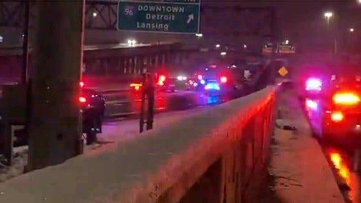 Police on the scene where a body was found along the Southfield Freeway on Jan. 23, 2023.