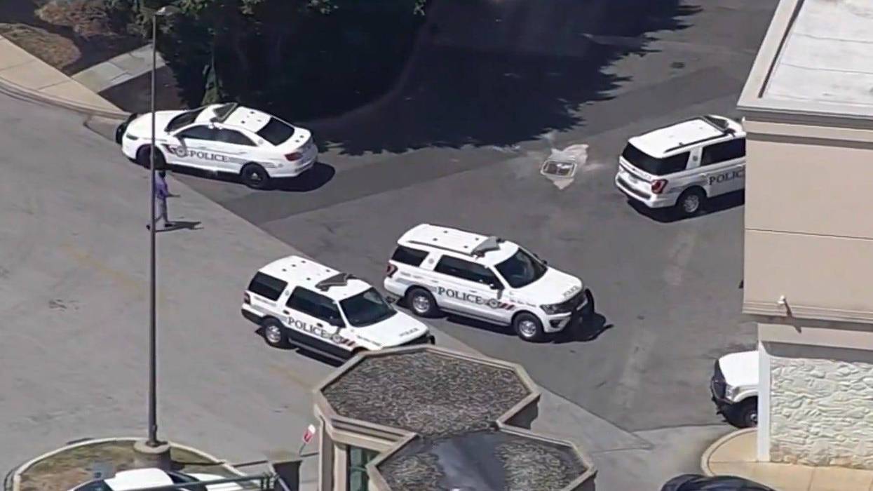 Police outside King of Prussia Mall, where a woman was arrested after allegedly pulling a gun out during a confrontation near the Five Guys in a busy food court.