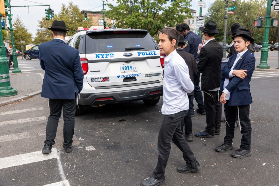 Police patrol a neighborhood in Brooklyn with a large Orthodox Jewish community on Oct. 12, 2023