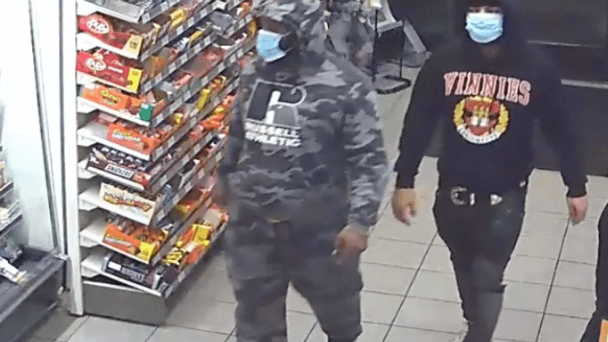 Police released images Wednesday of two men they're searching for in the Nov. 12 robbery
