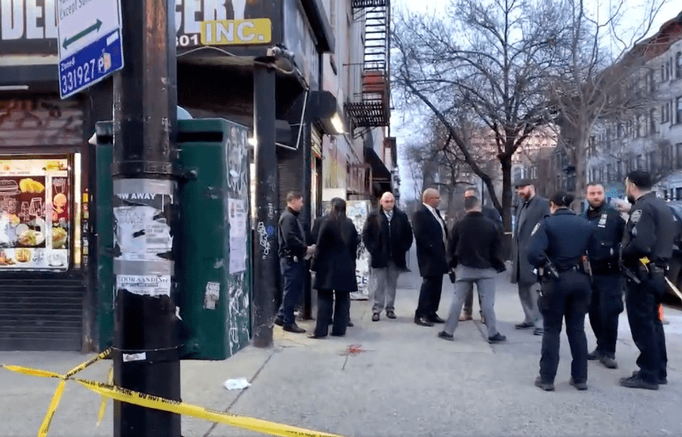 Police respond to the shooting of Nazim Berry on Monday afternoon