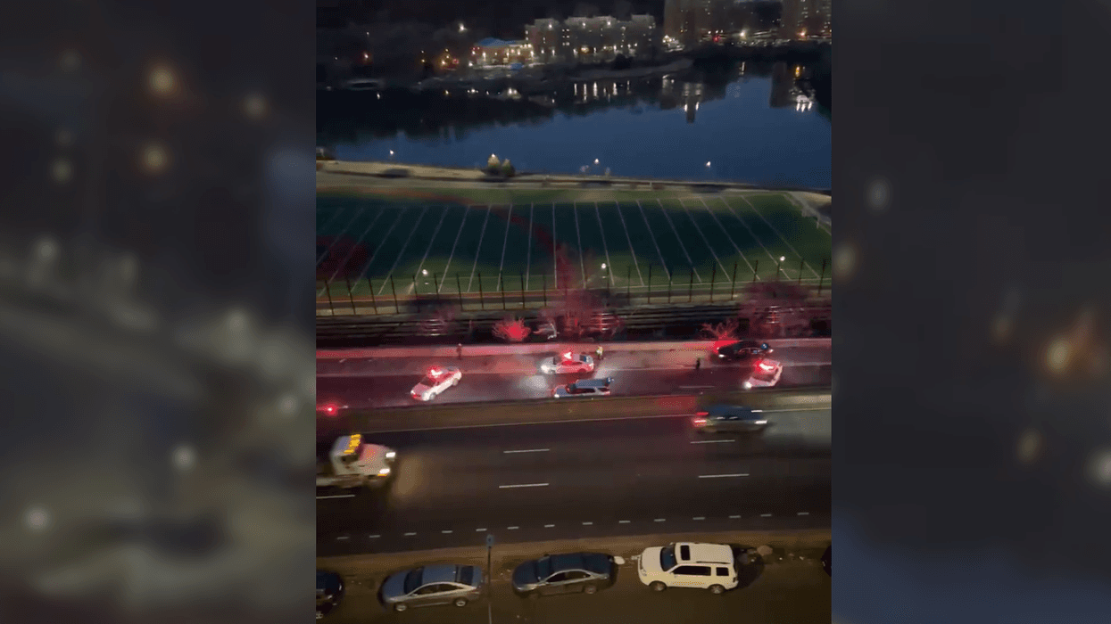 Police said a driver fired from a moving car on the Major Deegan Expressway early Friday, wounding a man in another car. Police were seen investigating at the scene before sunrise