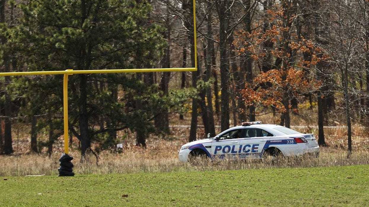 Police set up a crime scene at a park in Central Islip, Long Island.