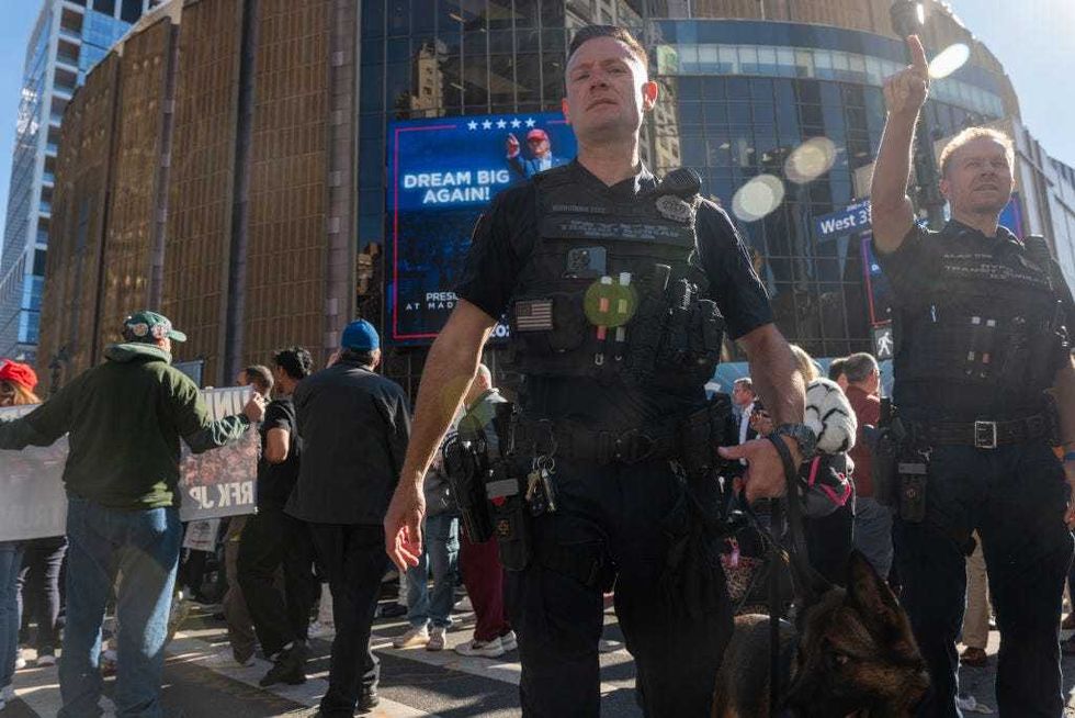 Police stand guard as people line up to see former President Donald Trump speak at Madison Square Garden during a campaign rally on Oct. 27, 2024 in New York City.