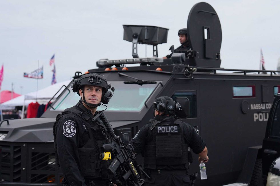 Police stand guard before a campaign rally by Donald Trump in Uniondale on Sept. 18, 2024