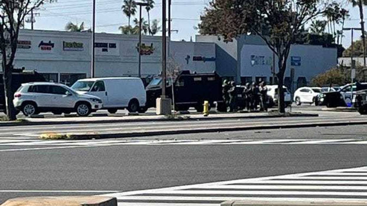 Police standoff with a van in a parking lot in Torrance with the alleged Monterey Park shooter in the passenger seat.