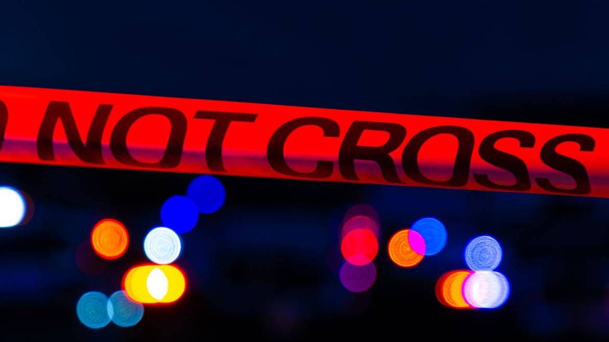 Police tape and emergency vehicle lights