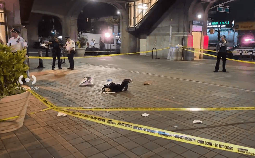 Police tape cordoned off the area where the teen was stabbed in the neck at 46th Street and Queens Boulevard