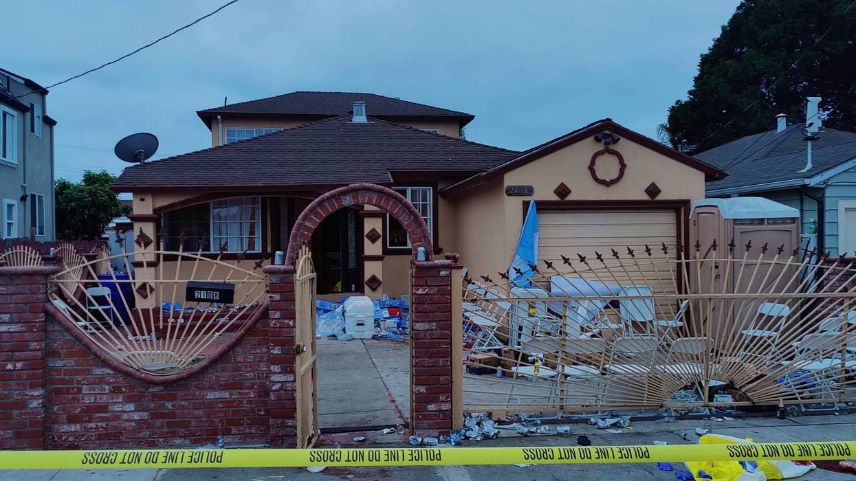 Police tape in front of a house in north Richmond.