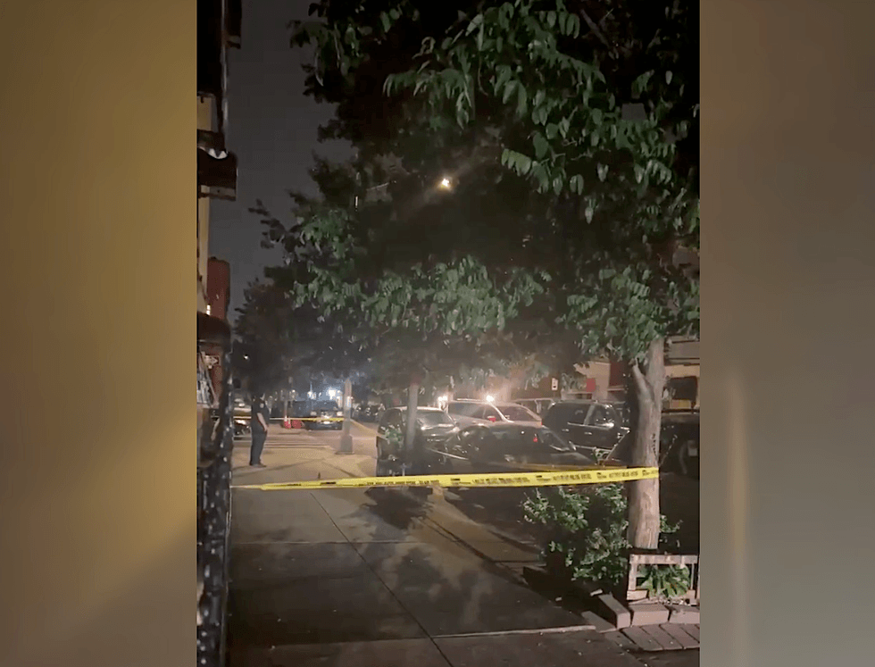 Police tape up at the scene of a shooting in the Charlotte Gardens section of the Bronx