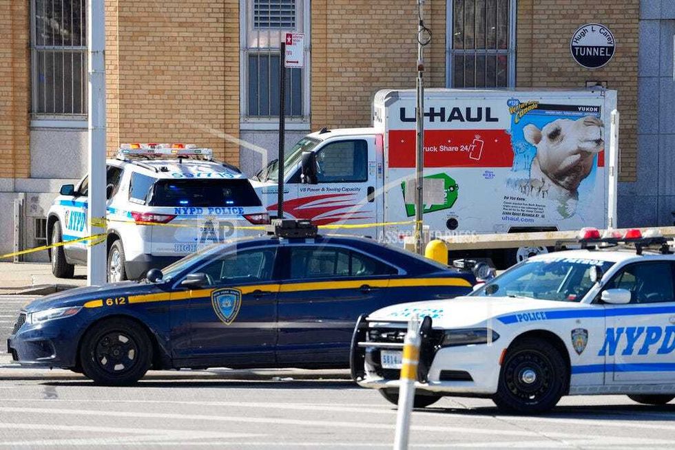 Police vehicles surround a U-Haul truck that was stopped and the driver arrested on Feb. 13, 2023, in Red Hook