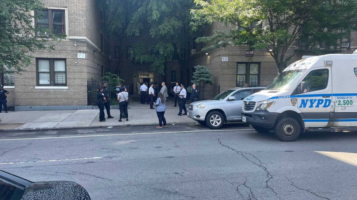 Police were seen outside of the off-duty officer's apartment building in the Concourse Village section on Monday morning