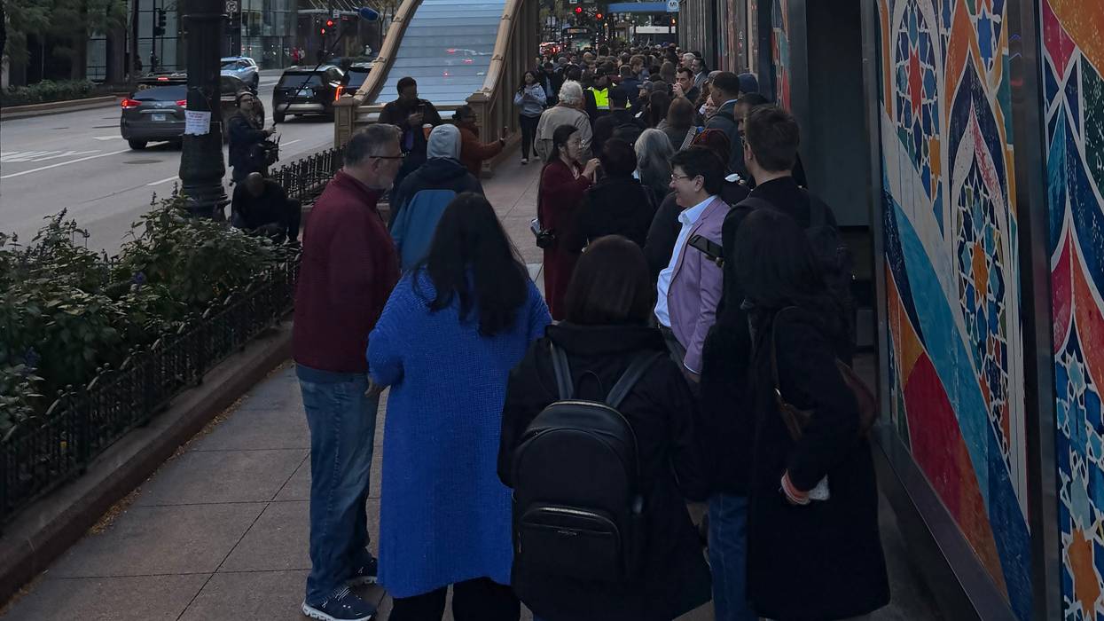 Politicians and supporters line up on South State Street to turn in nominating petitions for February's citywide election.