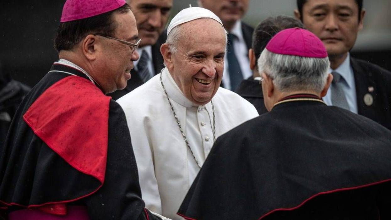 Pope Francis is bade farewell by senior Catholic clergy as he prepares to board his plane before leaving Japan