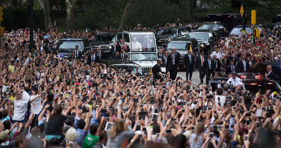 Pope Francis rides through Central Park in the popemobile on September 25, 2015 in New York City