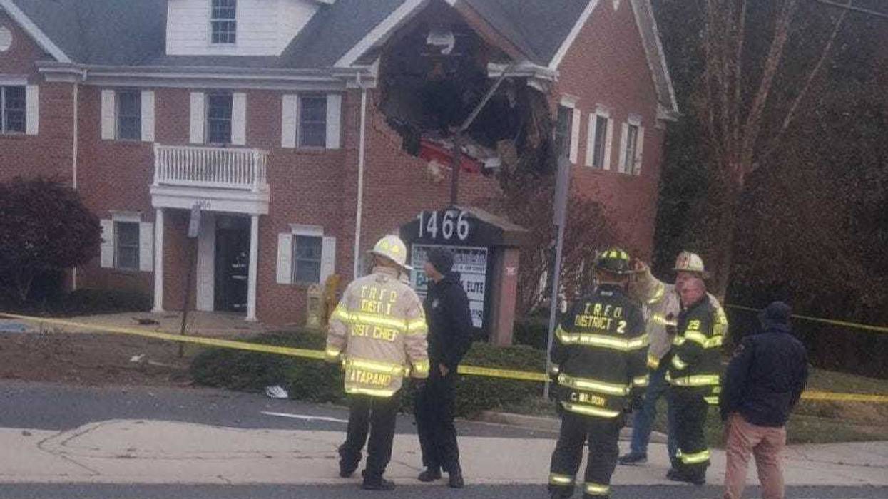 Porsche crashes into NJ office building