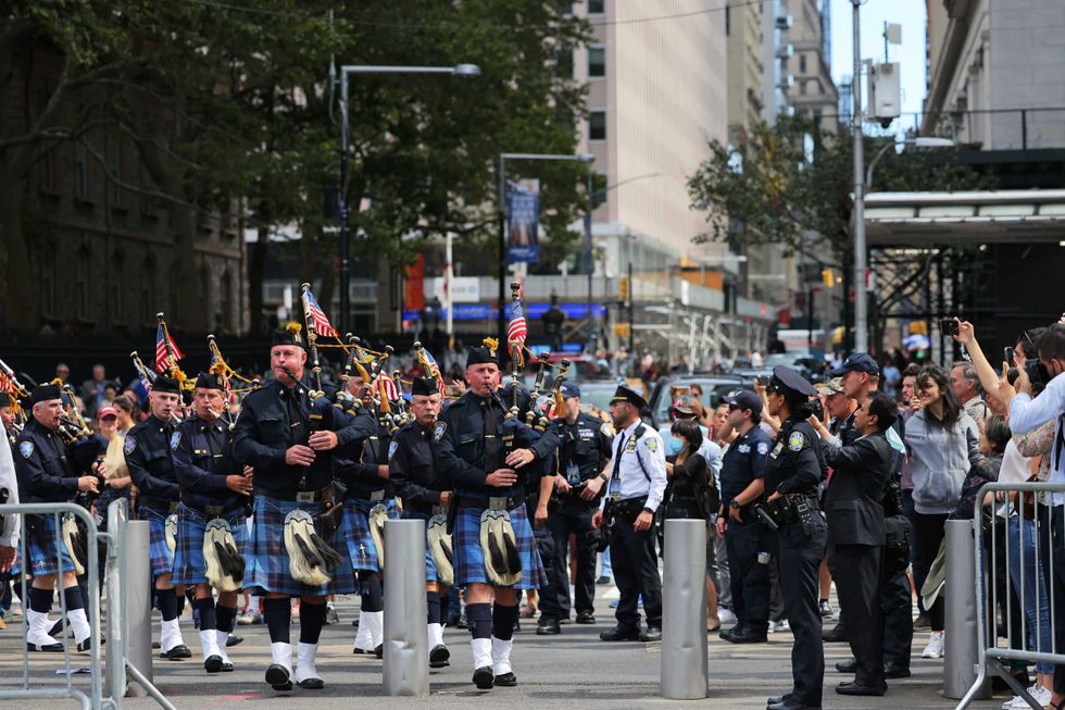 Port Authority Police bagpipers perform at the start of a Port Authority Interfaith Remembrance Service on the 20th anniversary of September 11th at the North Oculus Plaza on September 11, 2021 in New York City