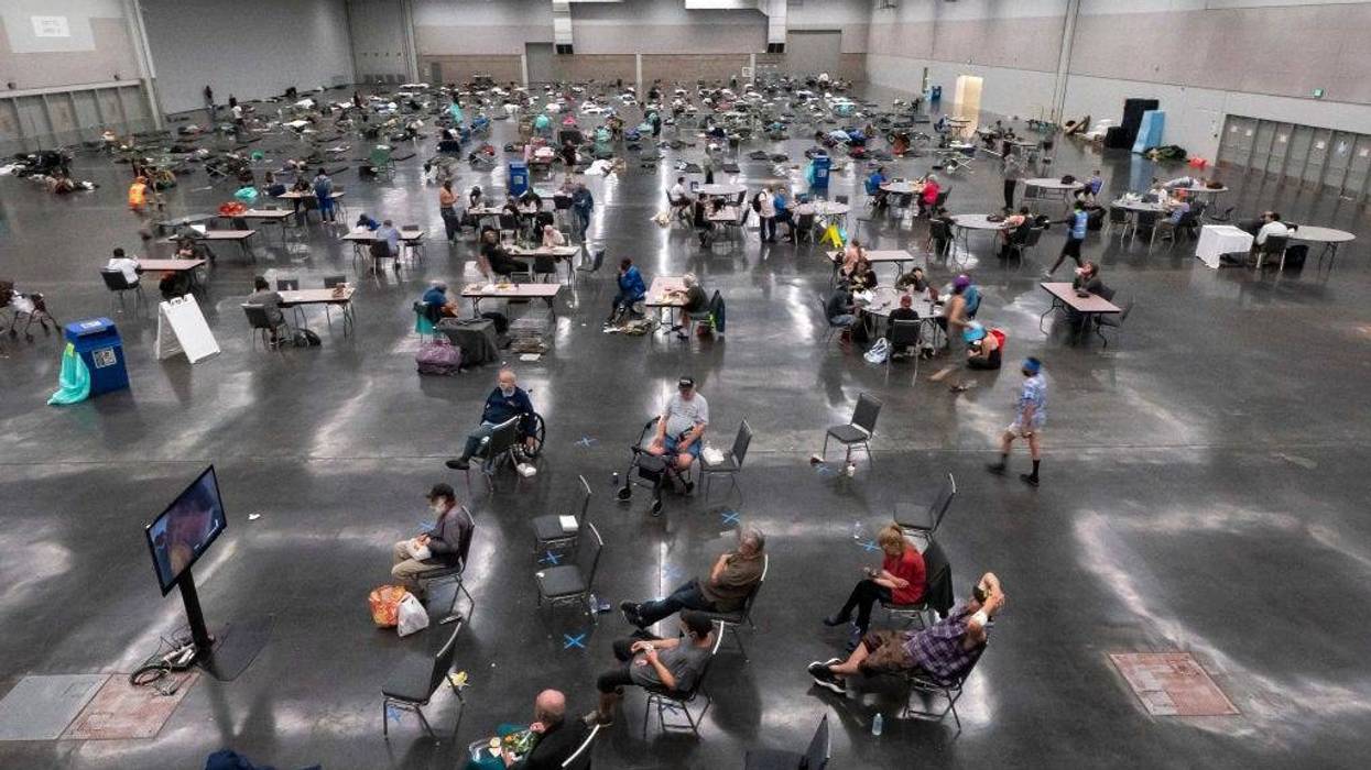 Portland residents fill a cooling center with a capacity of about 300 people at the Oregon Convention Center June 27, 2021 in Portland, Oregon.