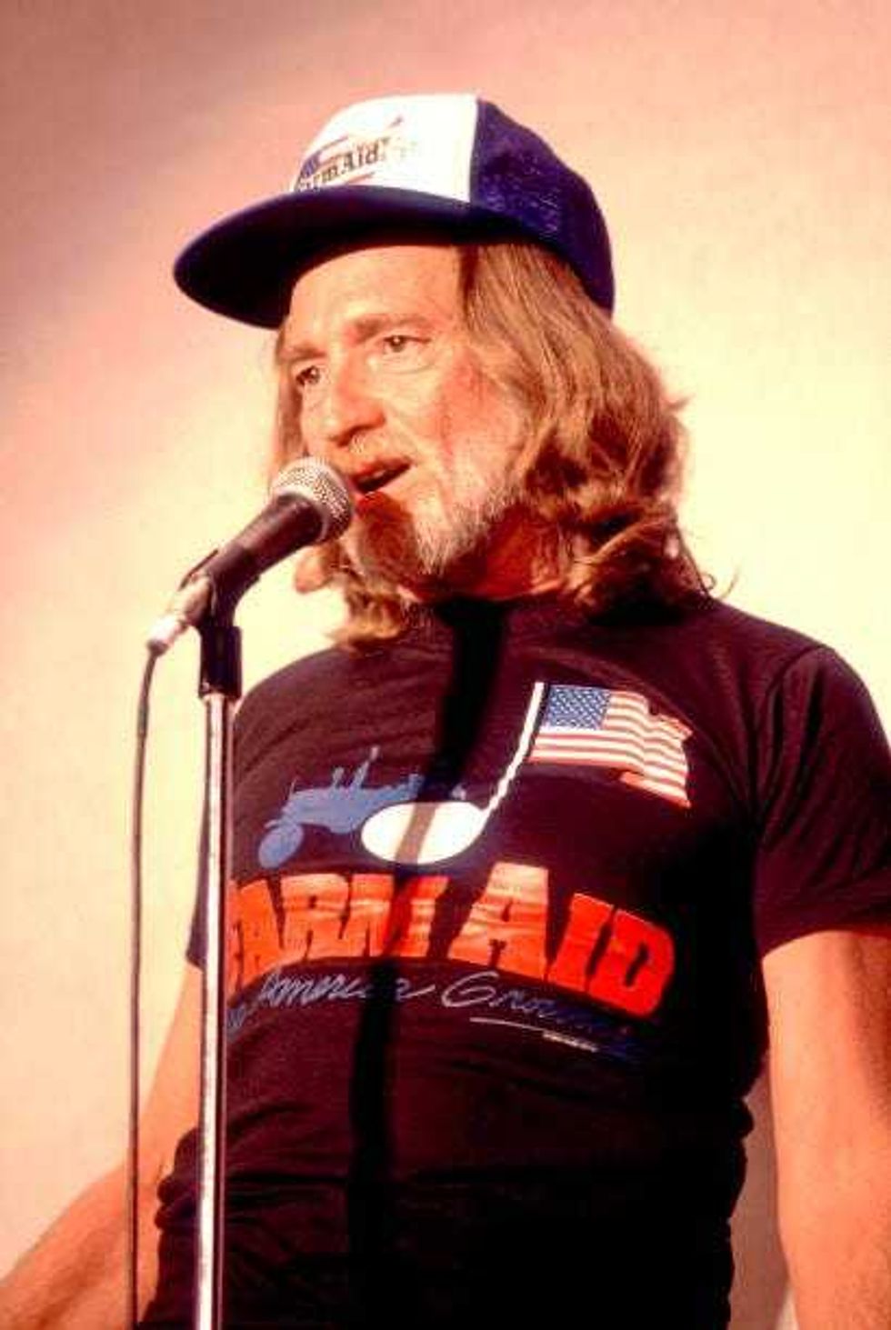 Portrait of country singer Willie Nelson at Memorial Stadium at the University of Illinois - Champaign for the first Farm Aid Concert in Champaign, Illinois, September 22, 1985.