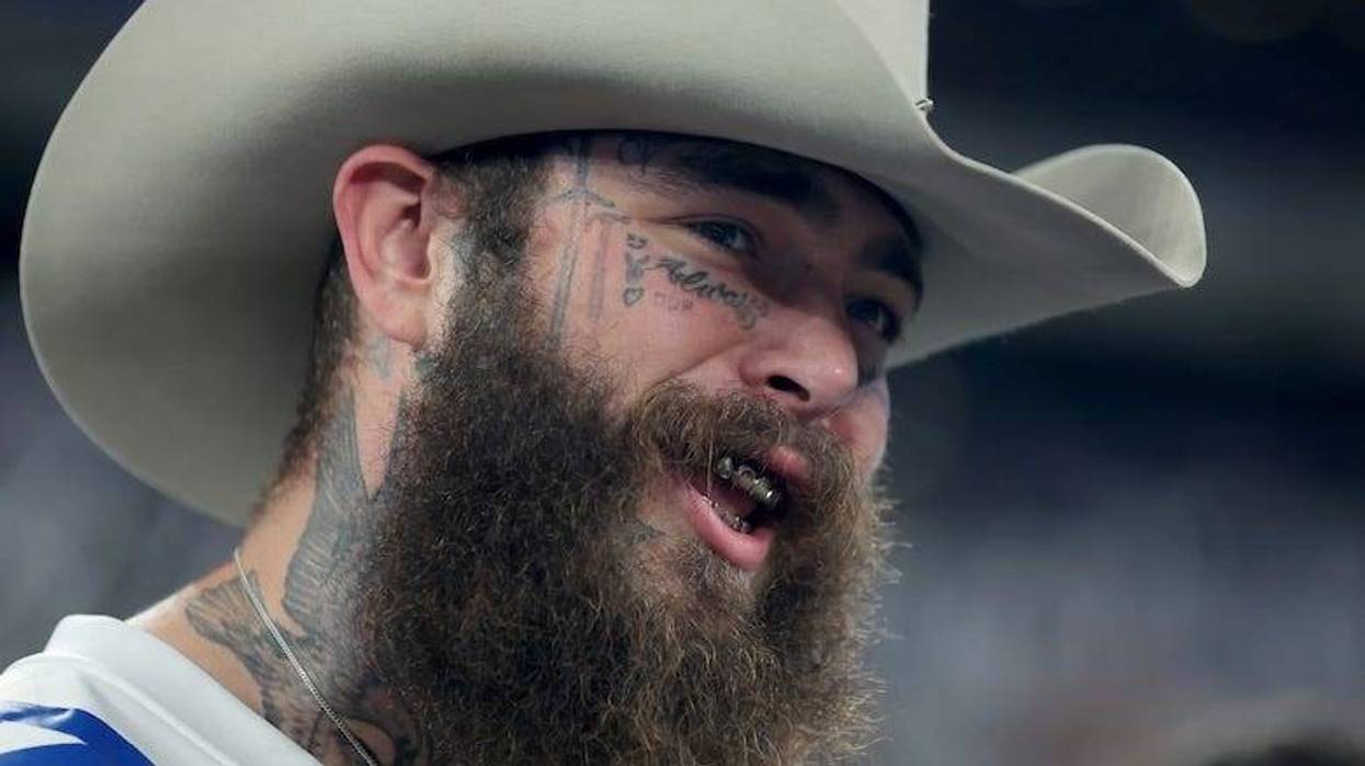 Post Malone on the field before a game between the New York Giants and the Dallas Cowboys at MetLife Stadium
