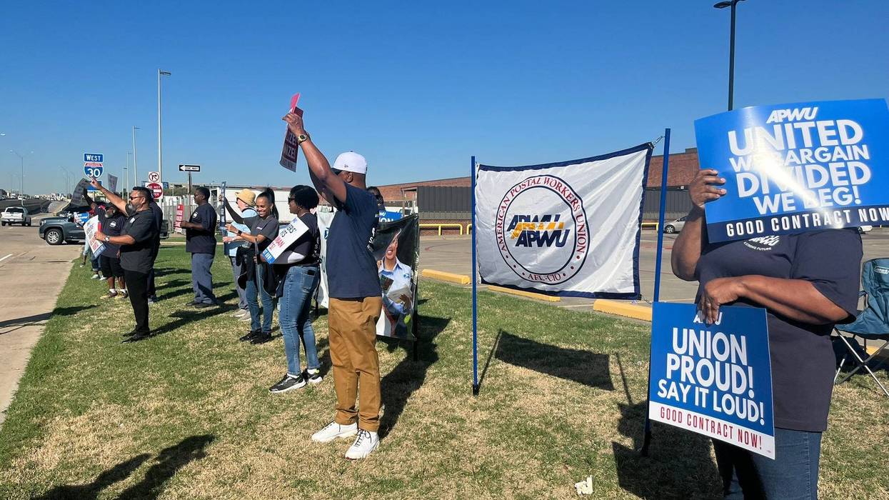 Postal workers picket in Dallas, Texas on Tuesday, Oct. 1, 2024.