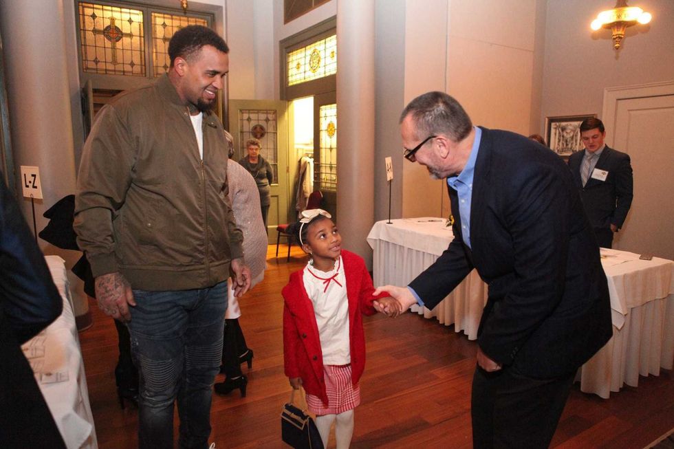 Pouncey with a child