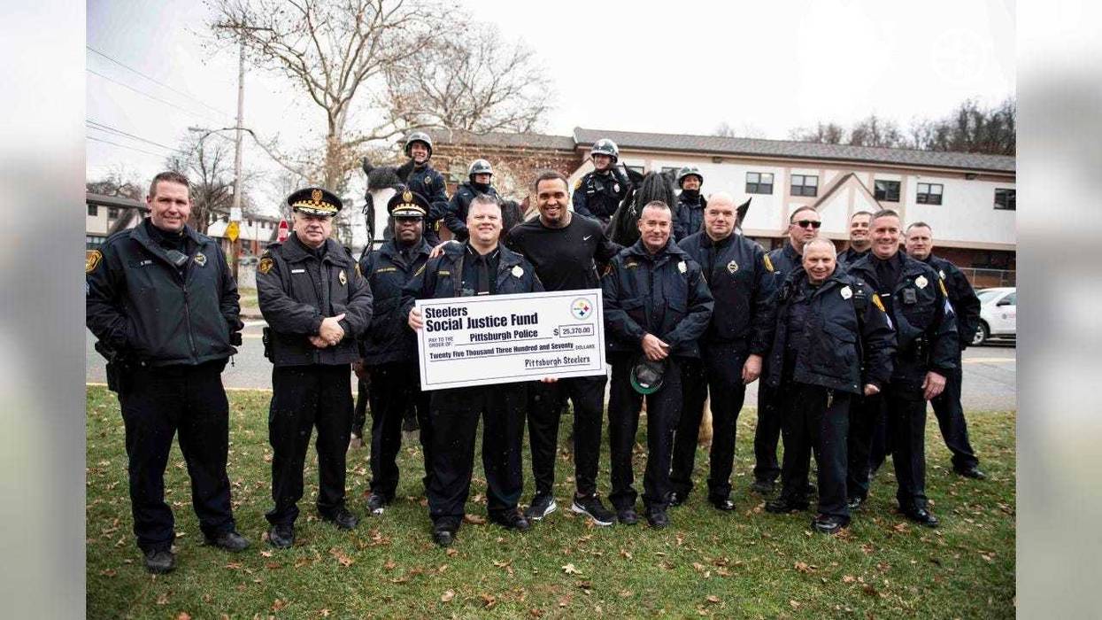 Pouncey with group of police