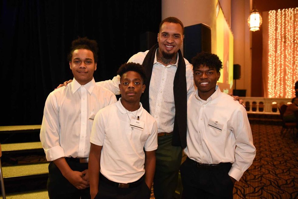 Pouncey with several boys