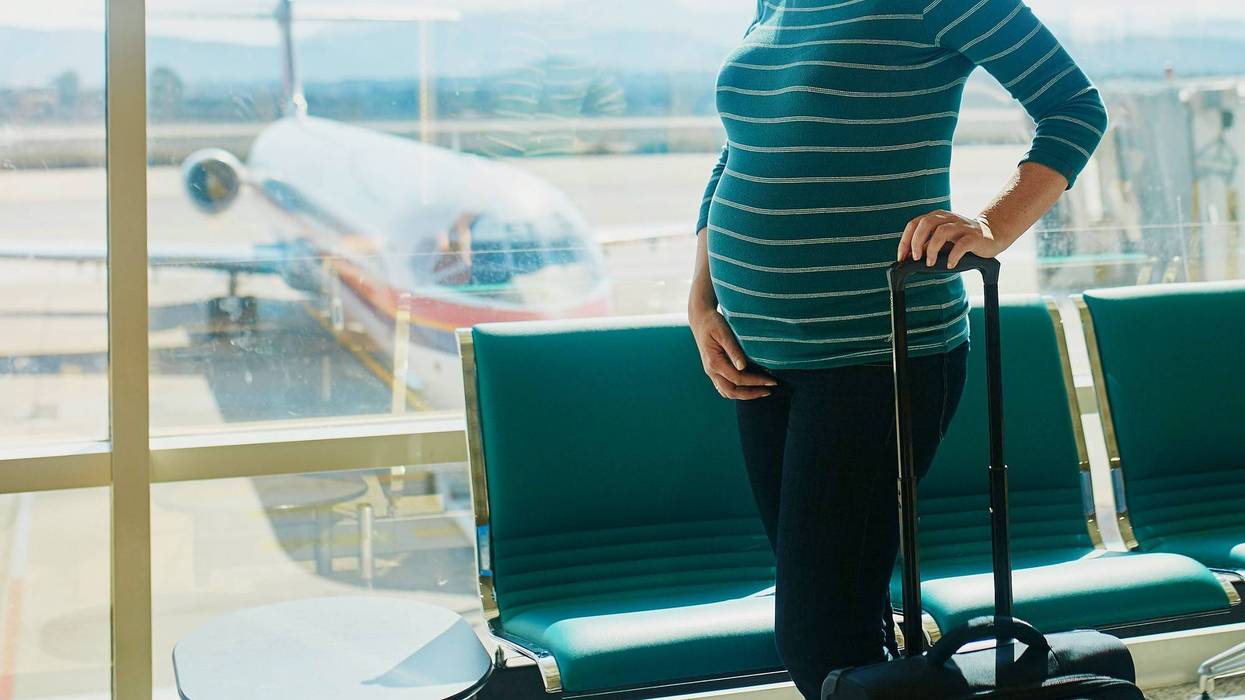 pregnant woman at airport