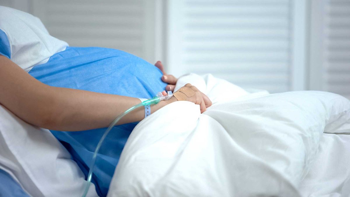 Pregnant woman in hospital stock image.