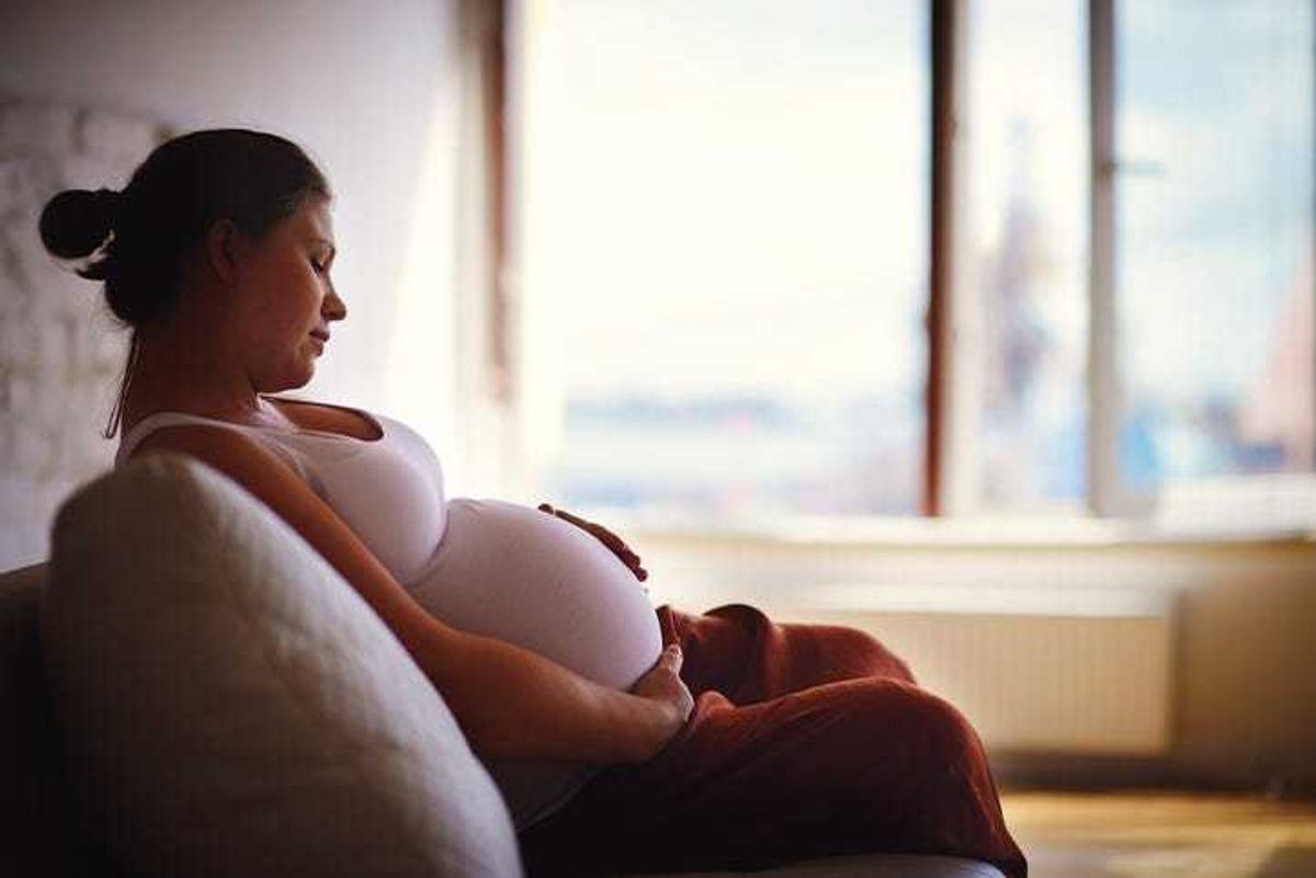 Pregnant woman sitting