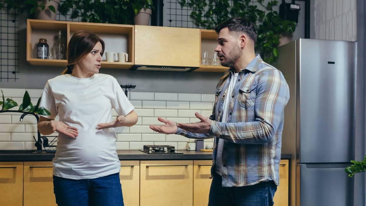 Pregnant Woman Talking To Her Husband