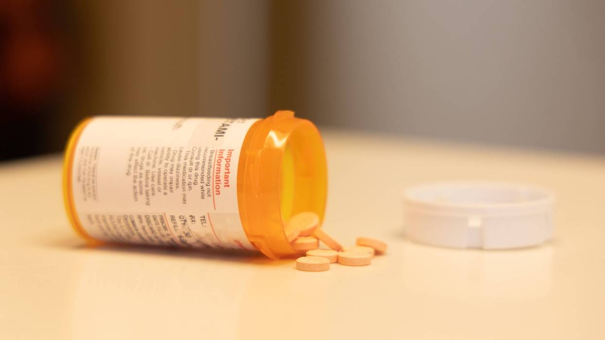 prescription bottle with pills on table