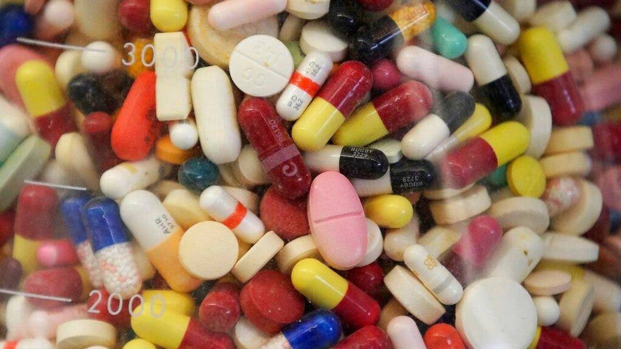 prescription drugs in a glass flask