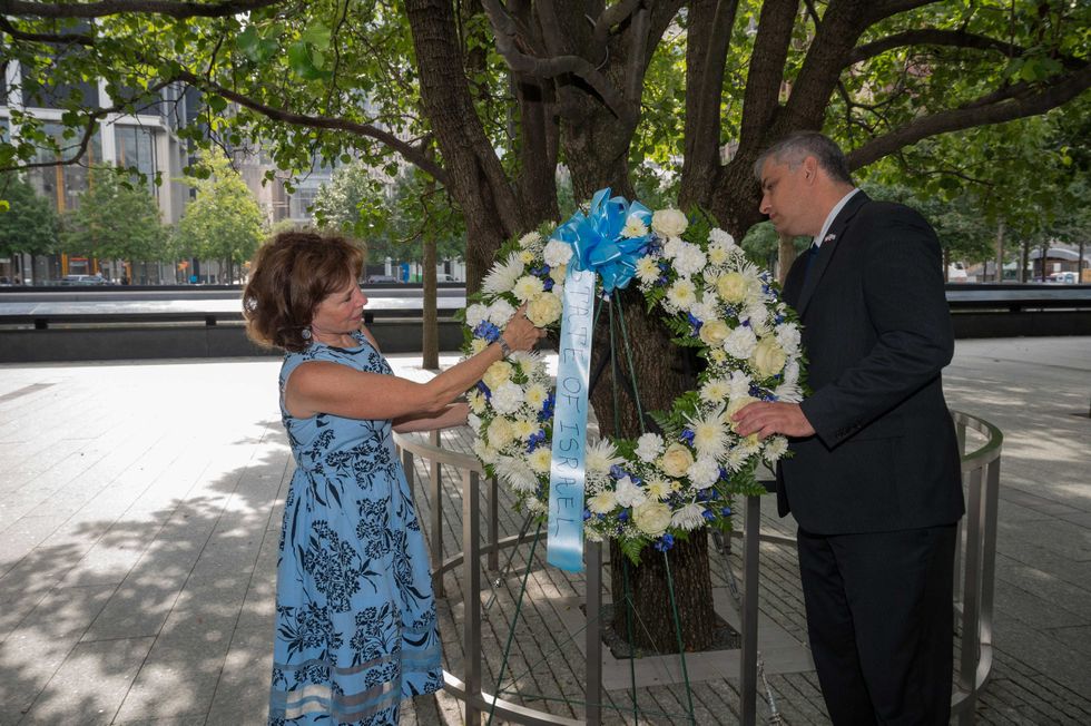 President at UJA-Federation of New York Amy Bressman and Acting Consul General of Israel in New York Israel Nitzan place a wreath at the Survivor Tree to honor the fallen in Ground Zero on August 31, 2021 in New York City.