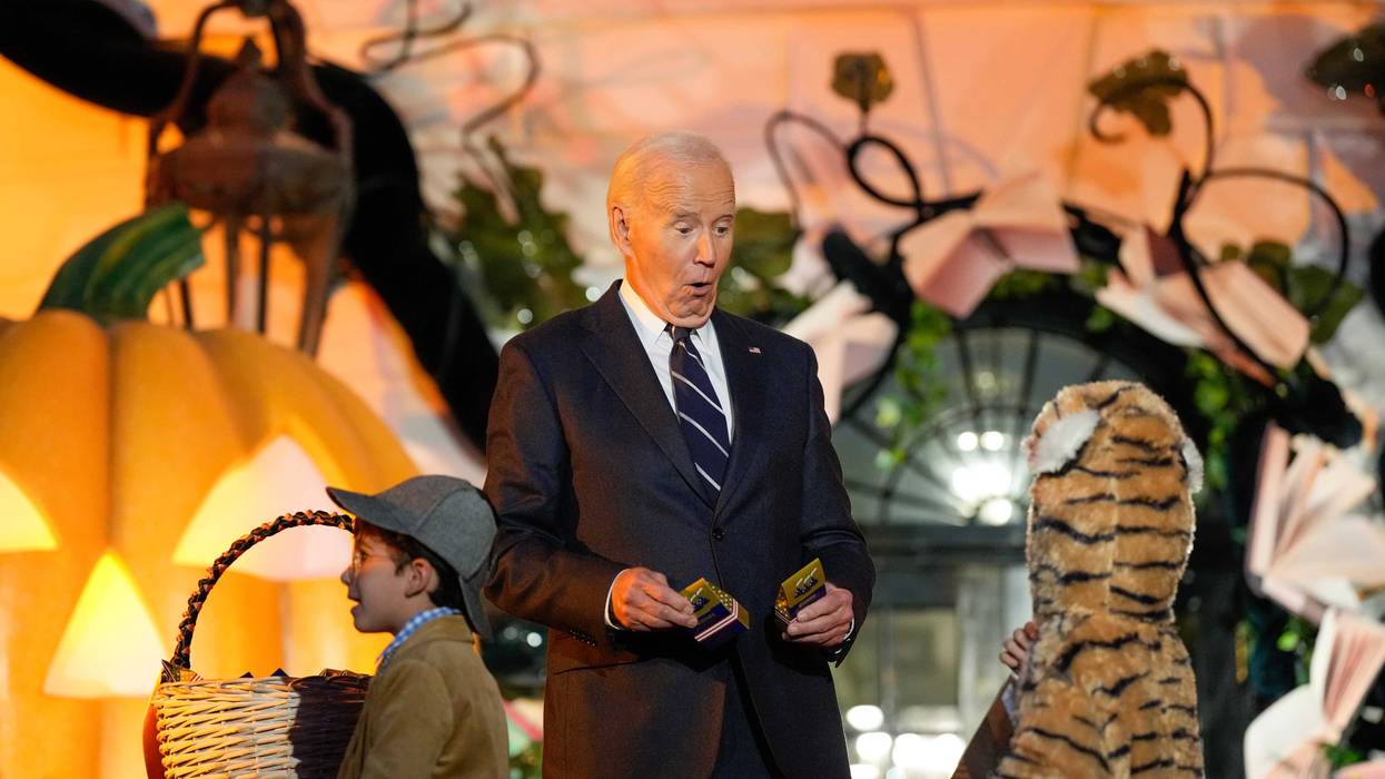 President Biden greets a trick-or-treater during a Halloween event at the White House on October 30, 2024
