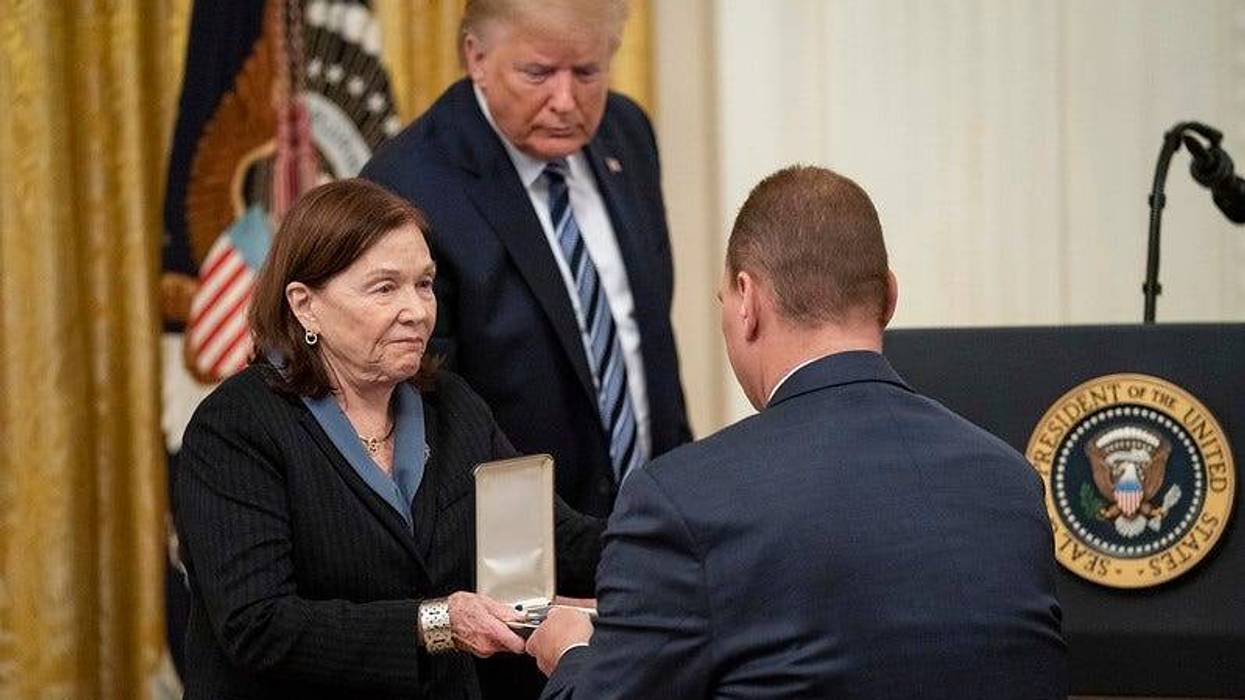 President Donald J. Trump looks on as Susan Rescorla shows the Presidential Citizens Medal, posthumously awarded to her husband Richard “Rick” C. Rescorla, to her son Trevor Thursday, Nov. 7, 2019.