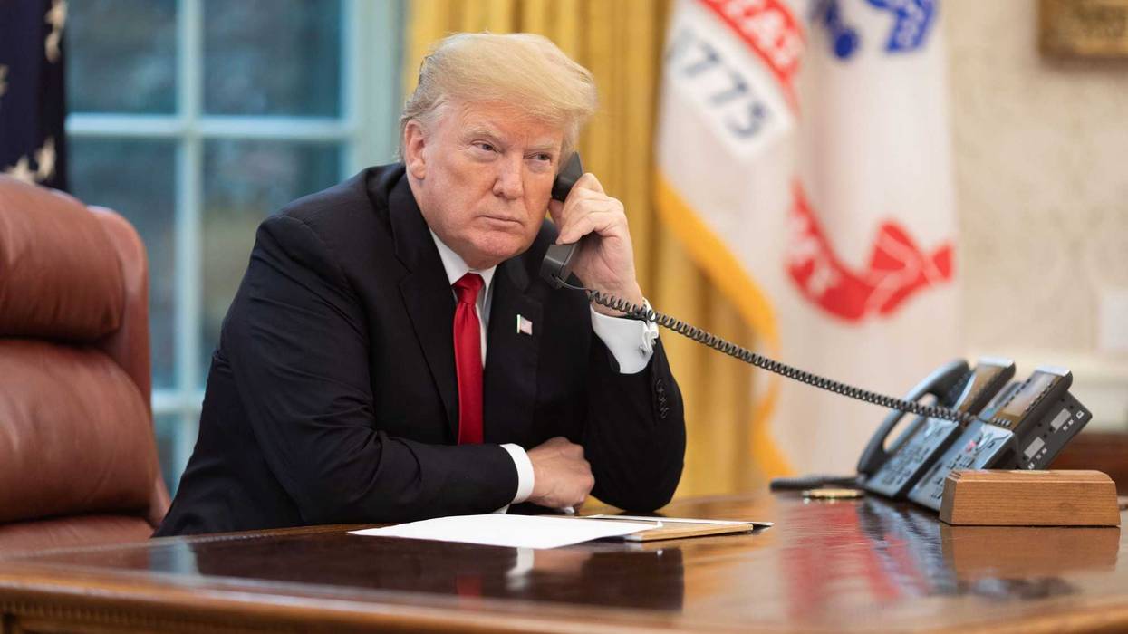 President Donald J. Trump speaks on the phone in the Oval Office