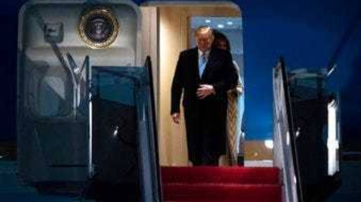 President Donald Trump and first lady Melania Trump exit Air Force One, Sunday, Jan. 5, 2020, at Andrews Air Force Base, Md., following a trip to his Mar-a-Lago estate. (AP Photo/Kevin Wolf)